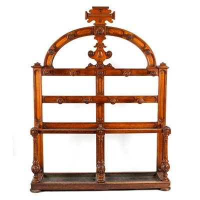 Lot 232 - A mid-Victorian oak hall stand, the arched top...