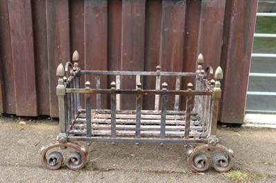 Lot 247 - A basket grate with turned finials and splay...