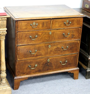 Lot 257 - An early 18th Century walnut chest of three...