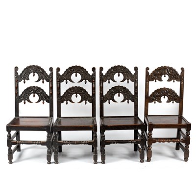 Lot 261 - Four oak dining chairs with serrated arched...