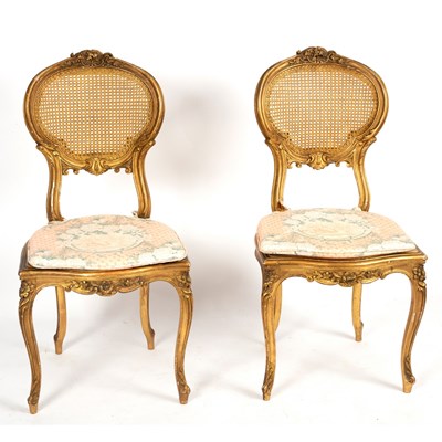 Lot 309 - A pair of Louis XVI gilded chairs with cane...