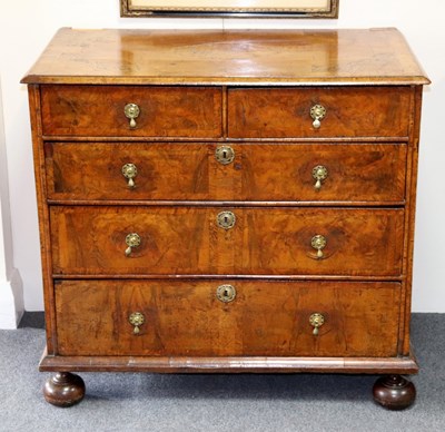 Lot 310 - A William & Mary burr walnut chest, the...