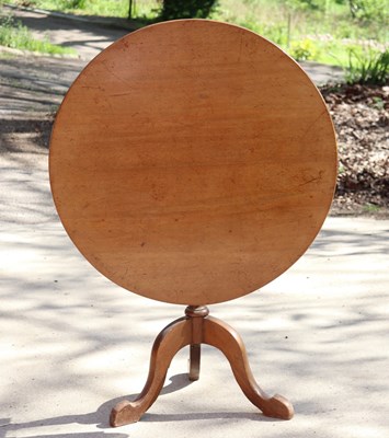 Lot 313 - A circular mahogany table on a turned column...