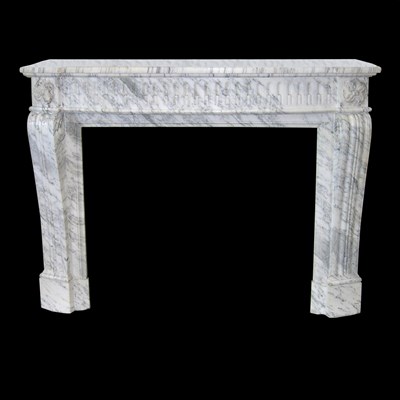 Lot 324 - A carved Louis XVI style chimneypiece in...