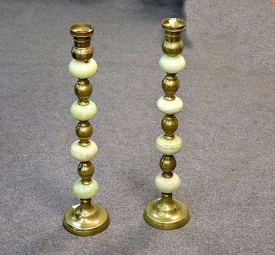 Lot 329 - A pair of brass candlesticks with onyx knopped...