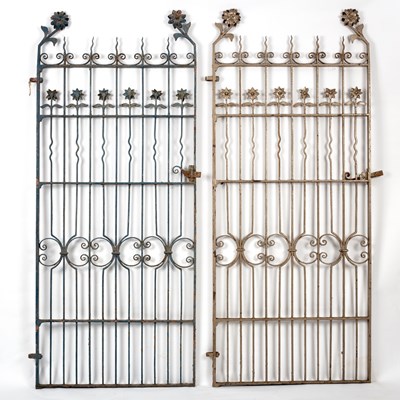 Lot 366 - A pair of wrought iron gates with flowerhead...