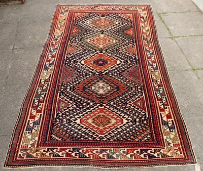 Lot 423 - A Shirvan rug of geometric design, 260cm x 130cm