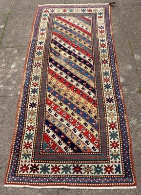 Lot 428 - A late 19th Century Kazak rug, 205cm x 80cm