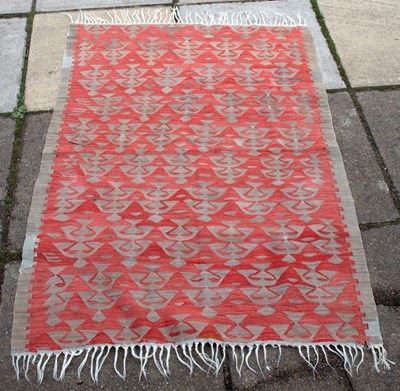 Lot 433 - A kilim rug of red ground, 140cm x 100cm