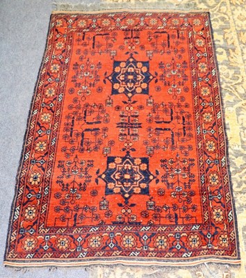 Lot 442 - A Turkoman rug, brick red ground with two...