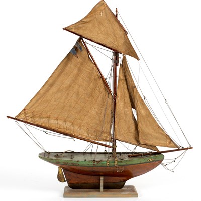 Lot 476 - A wooden pond yacht with rigging and stand,...