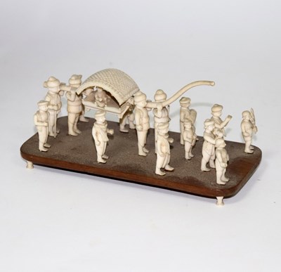 Lot 626 - An Indian carved ivory figure group, Company...