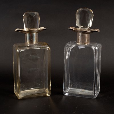 Lot 645 - A pair of silver mounted decanters with double...