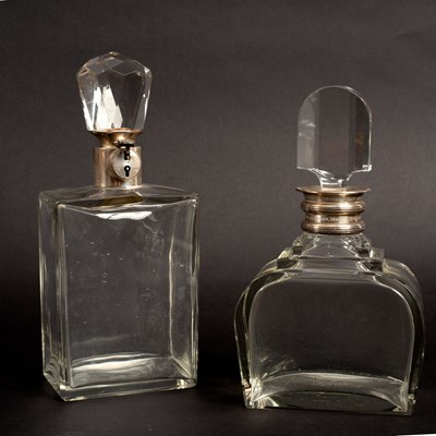 Lot 647 - Two silver mounted decanters, one lockable,...