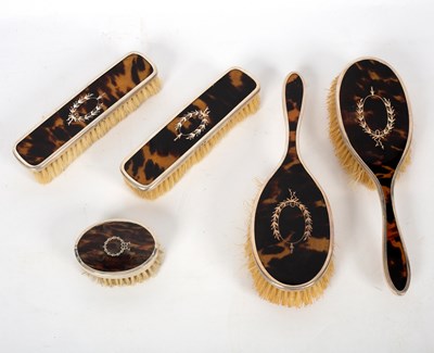 Lot 659 - A tortoiseshell backed dressing set of five...