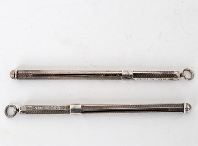 Lot 669 - Two sterling silver swizzle sticks