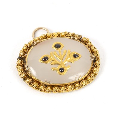 Lot 691 - A Mughal gem set oval pendant, framed in...