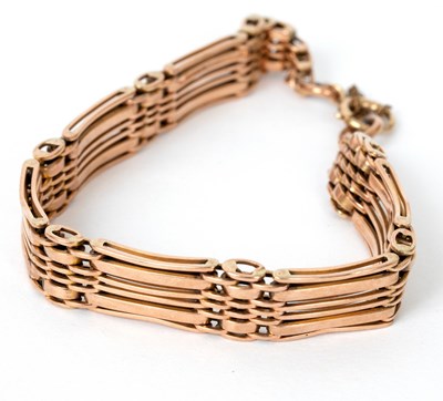 Lot 696 - A 9ct rose gold gate link bracelet,...