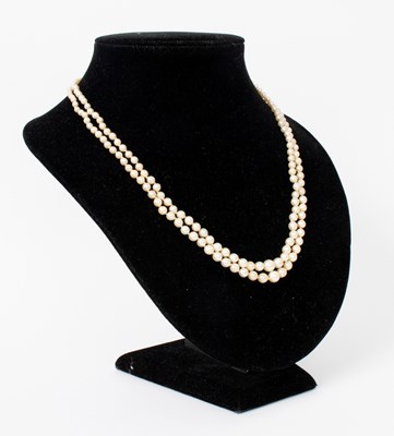 Lot 699 - A two-row pearl necklace (not tested), the...