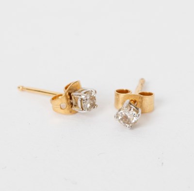 Lot 702 - A pair of diamond ear studs, claw set to 18ct...