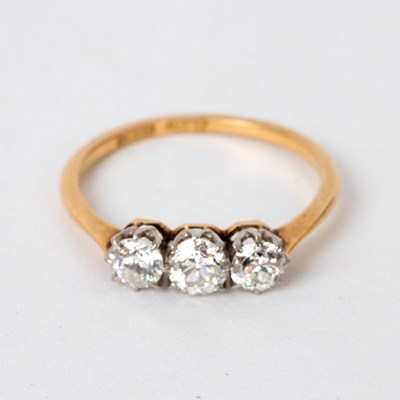 Lot 707 - A diamond three-stone ring, the stones set in...