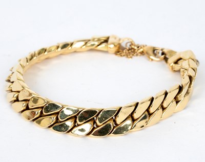 Lot 739 - An 18ct yellow gold bracelet of flattened...