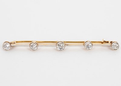 Lot 744 - A diamond set bar brooch, the five stones in...