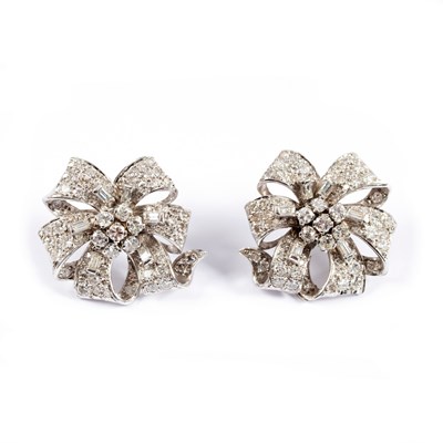 Lot 747 - A pair of diamond ear studs, each of ribbon...