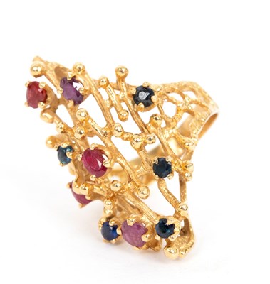 Lot 750 - A sapphire and ruby ring in the style of...