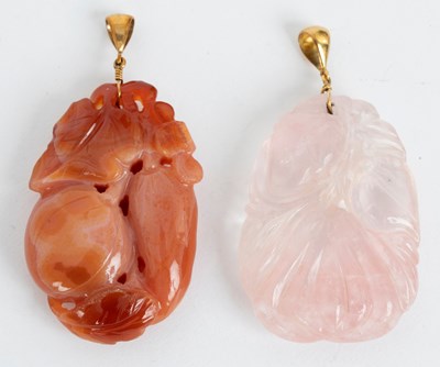 Lot 751 - Two Chinese carved hardstone pendants,...