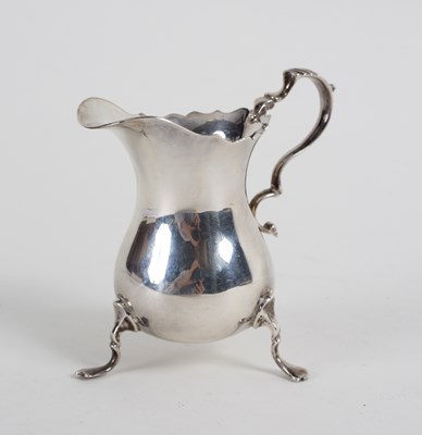 Lot 36 - A silver helmet-shaped cream jug, JBC & Son...