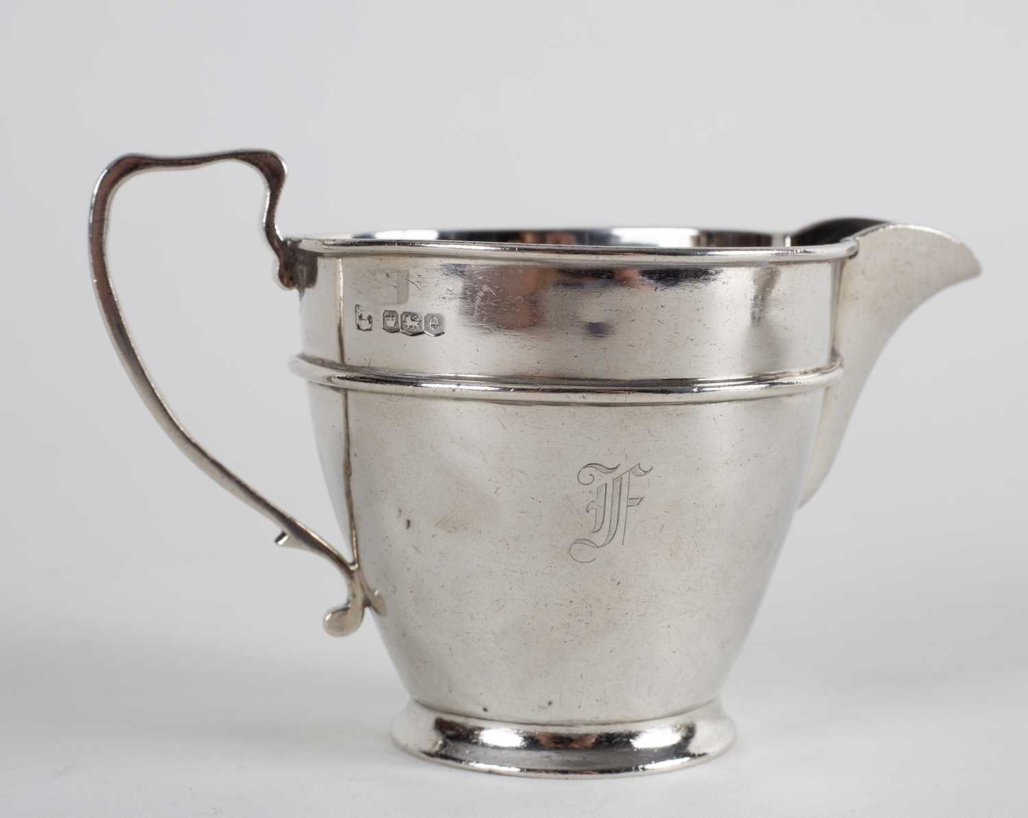 Lot 58 - An Art Deco silver three-piece tea set,...