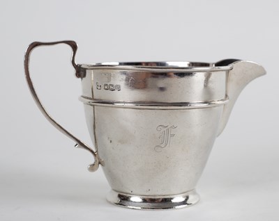 Lot 58 - An Art Deco silver three-piece tea set,...