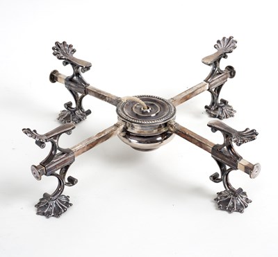 Lot 84 - A plated dish cross with anthemion supports...