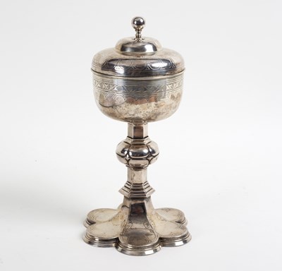 Lot 86 - A silver plated covered chalice, the domed...