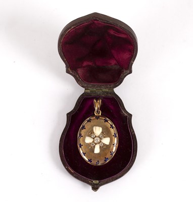 Lot 110 - A Victorian oval locket decorated a cross in...