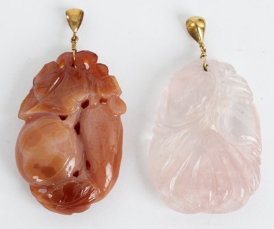 Lot 117 - Two Chinese carved hardstone pendants,...