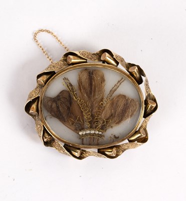 Lot 123 - A Victorian brooch, the central panel set with...