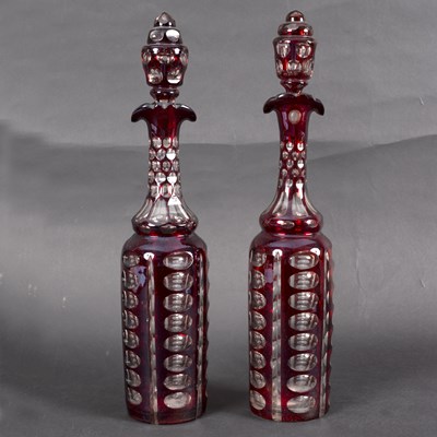 Lot 150 - A pair of ruby stained clear flash decanters...