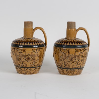 Lot 181 - A pair of stoneware flagons with raised...