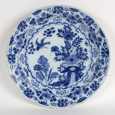 Lot 184 - A Dutch delft blue and white plate decorated...