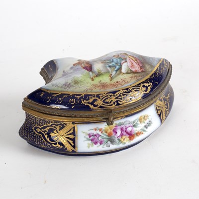 Lot 220 - A French porcelain box, the cover decorated...