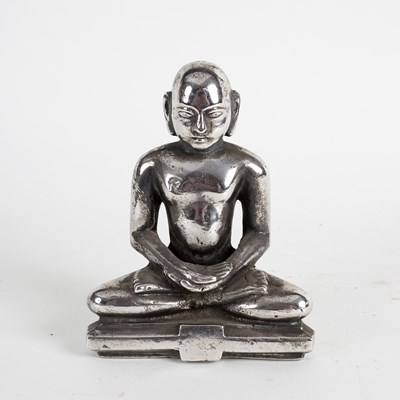 Lot 250 - A metal figure of a Buddha, seated, his open...