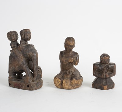 Lot 257 - An Indian carved wood pull-a-long elephant,...