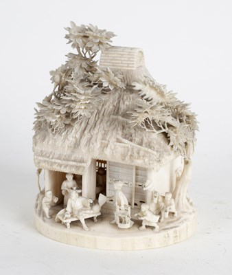 Lot 271 - A Japanese Meji period carved ivory cottage,...