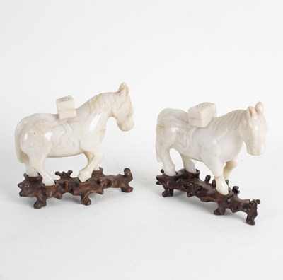 Lot 282 - A pair of Chinese jade carvings of horses,...