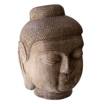 Lot 284 - A carved stone head of Buddha, 54cm high