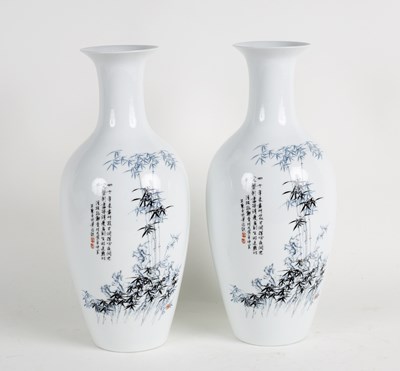 Lot 287 - A pair of Chinese vases decorated with bamboo...