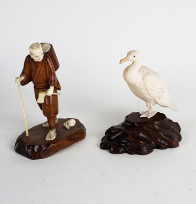 Lot 293 - A Japanese carved ivory figure of a cormorant,...