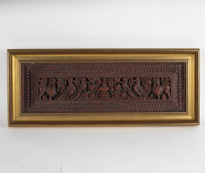 Lot 301 - An Indian carved hardwood panel depicting...